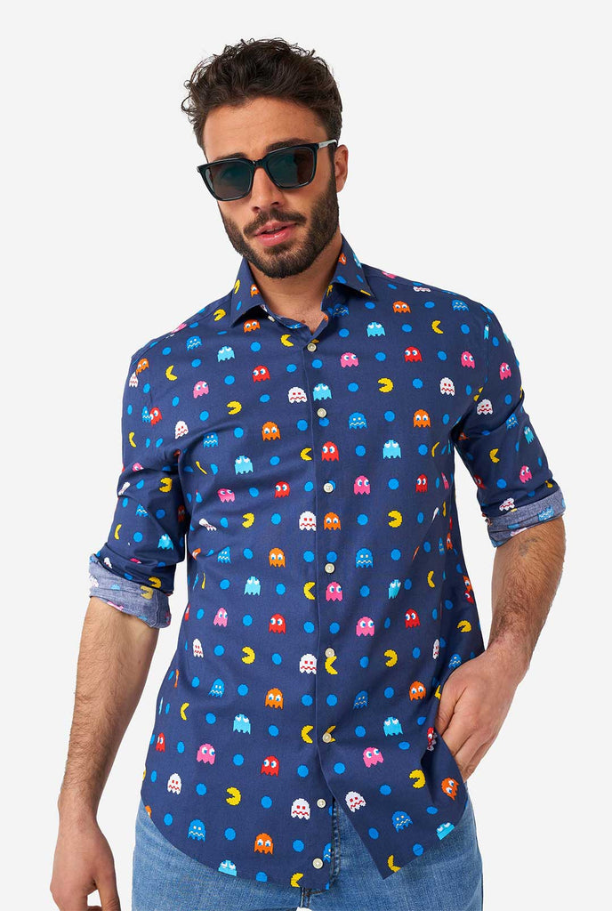 Man wearing blue dress shirt with Pac-Man icons