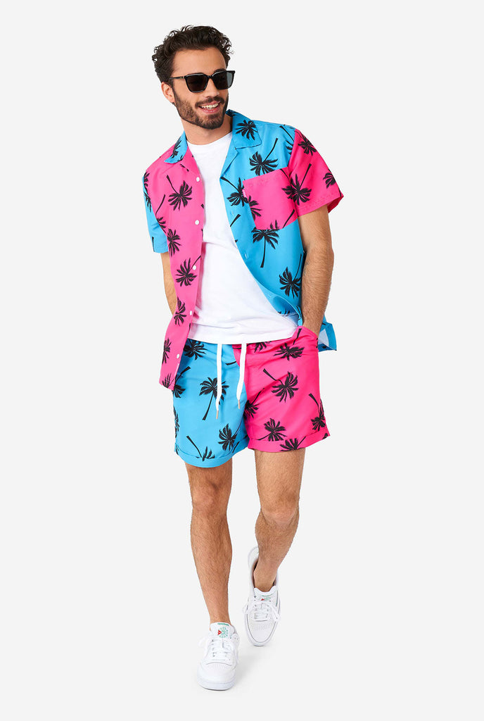 Man wearing summer set consisting of shorts and shirt