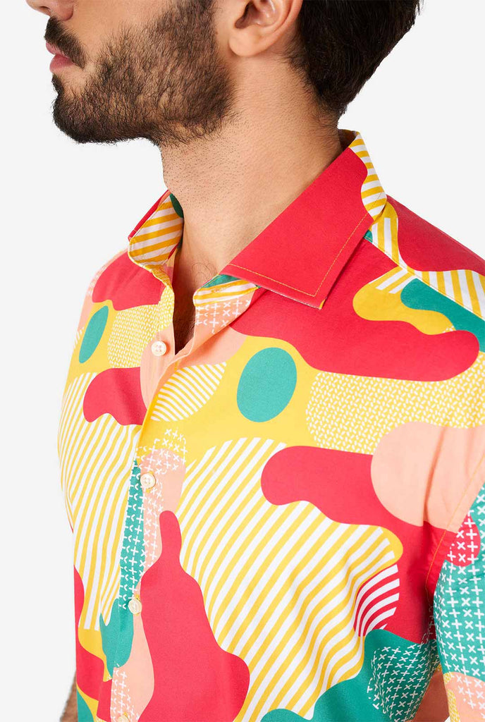 Man wearing summer shirt with colorful camouflage print