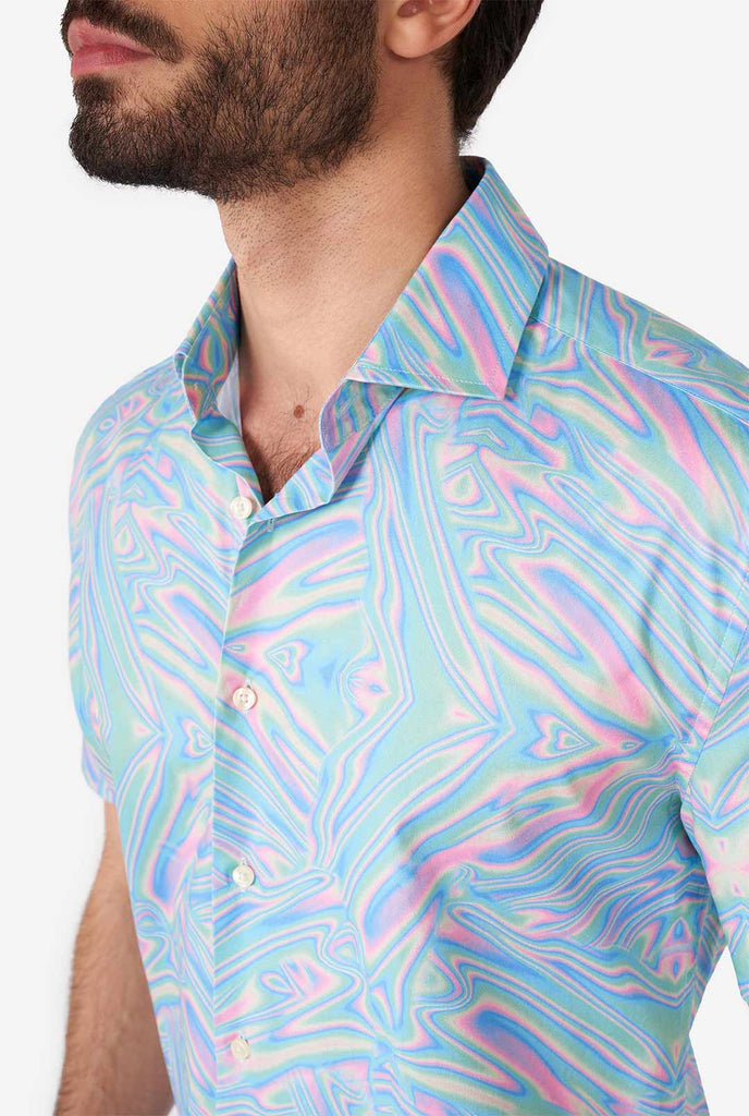 Man wearing short sleeve shirt with colorful oily print