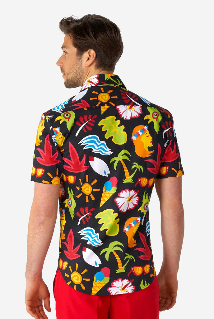 Man wearing black summer shirt with tropical icons and red short