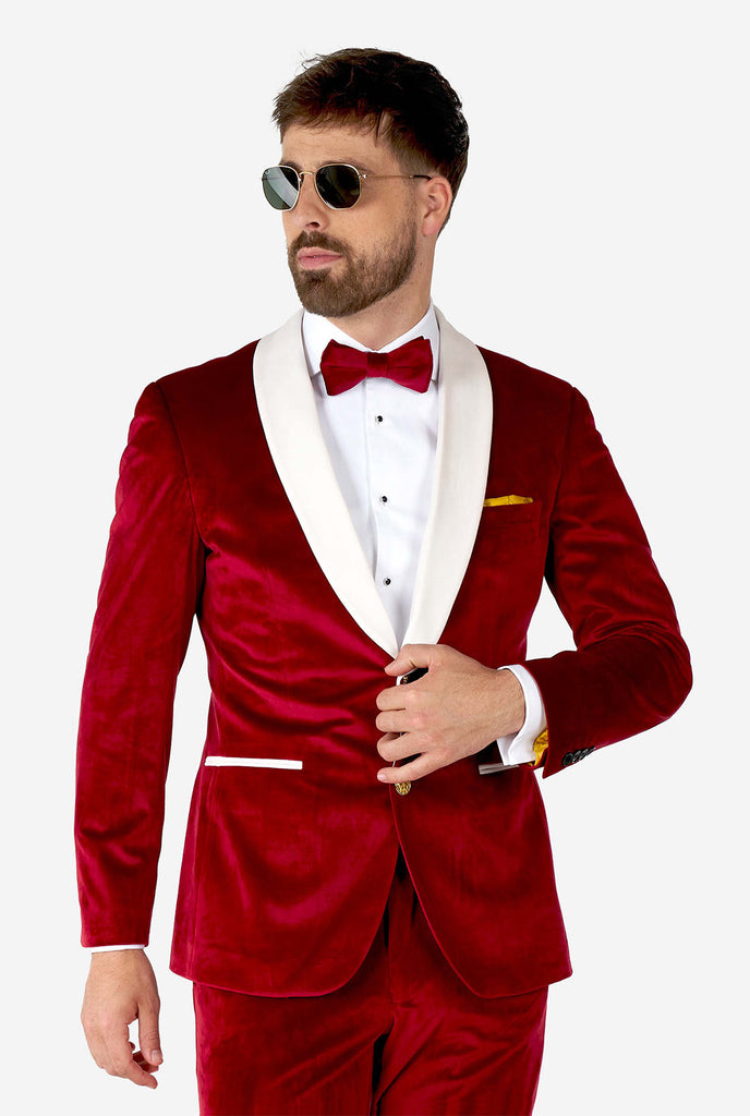 Man wearing red and white santa Christmas tuxedo