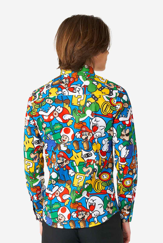 Teen wearing dress shirt with Super Mario print