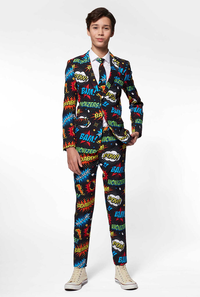 Teen wearing black suit with comic phrase print