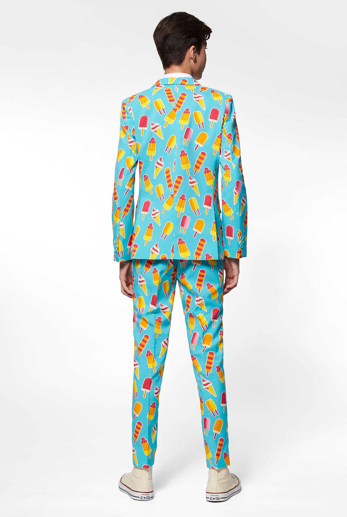 Teen wearing light blue formal suit with popsicle print