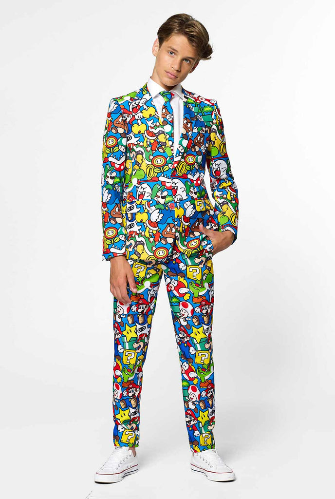 Teen wearing formal suit with colorful Super Mario print