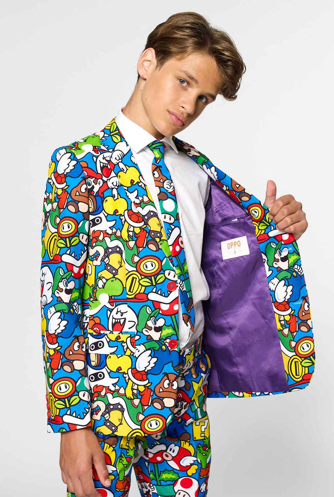 Teen wearing formal suit with colorful Super Mario print