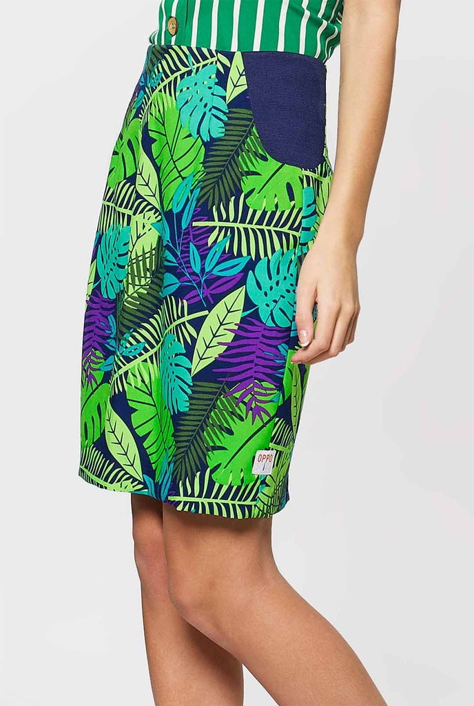 Woman wearing suit with green jungle leaves print