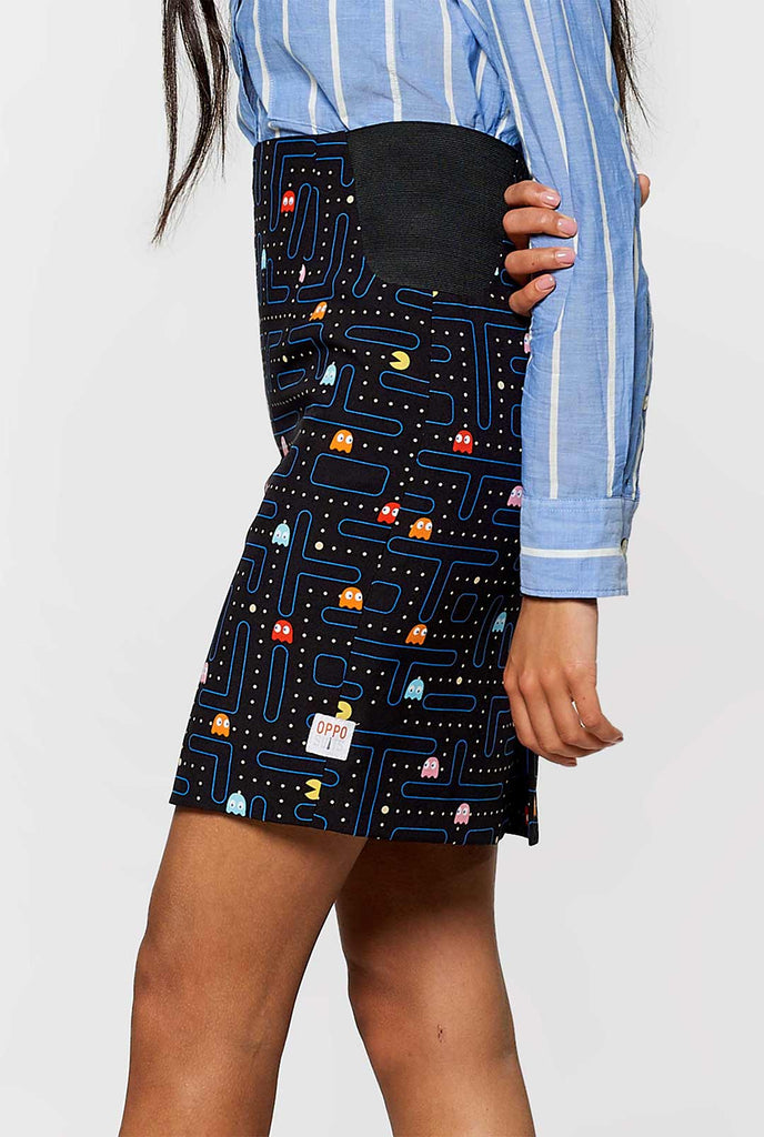 Woman wearing black dress suit with Pac-Man print