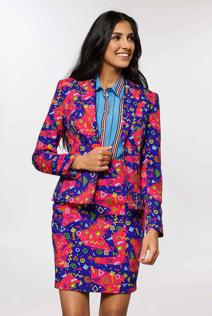 Woman wearing pink and purple suit with retro print
