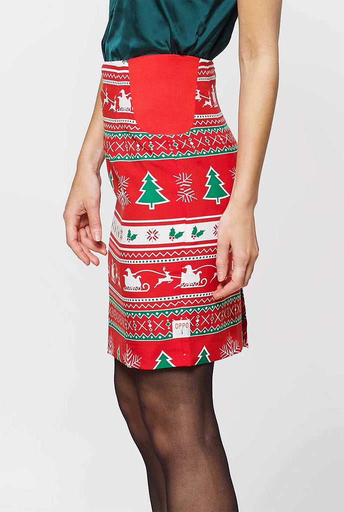 Woman wearing red Christmas suit with Christmas icons