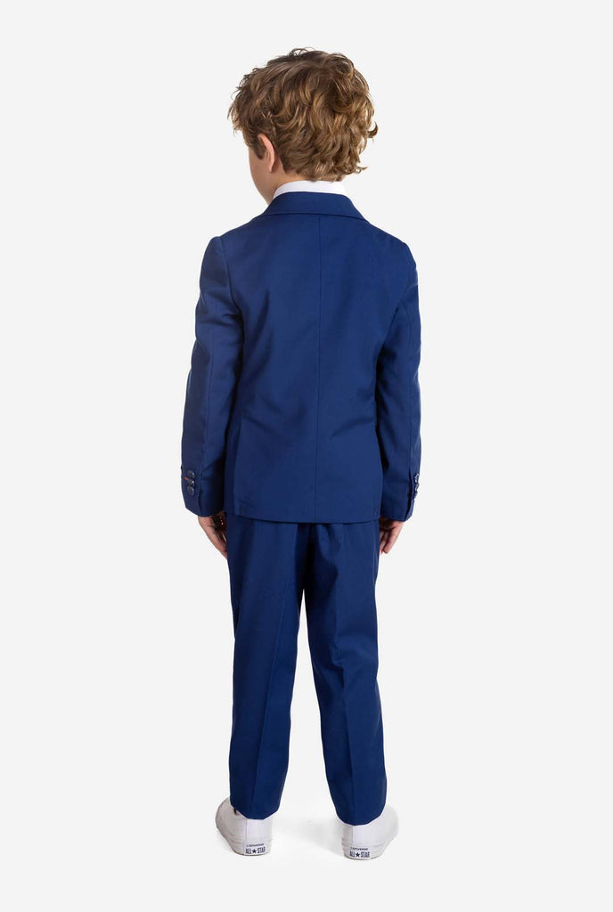 Boy wearing blue OppoSuits Daily kids suit, view from the back