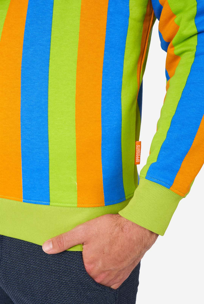 Man wearing Sesame Street Bert style Men's Sweater with green, blue and orange stripes, close up