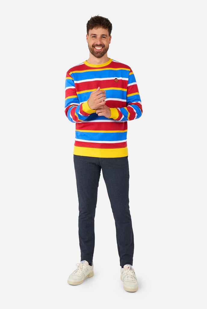 Man wearing Men's Sweater with iconic Sesame Street Ernie pattern with Yellow, red, blue and white stripes