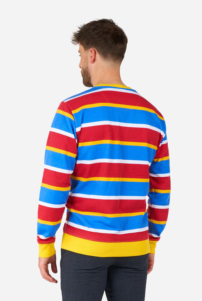 Man wearing Men's Sweater with iconic Sesame Street Ernie pattern with Yellow, red, blue and white stripes, view from the back